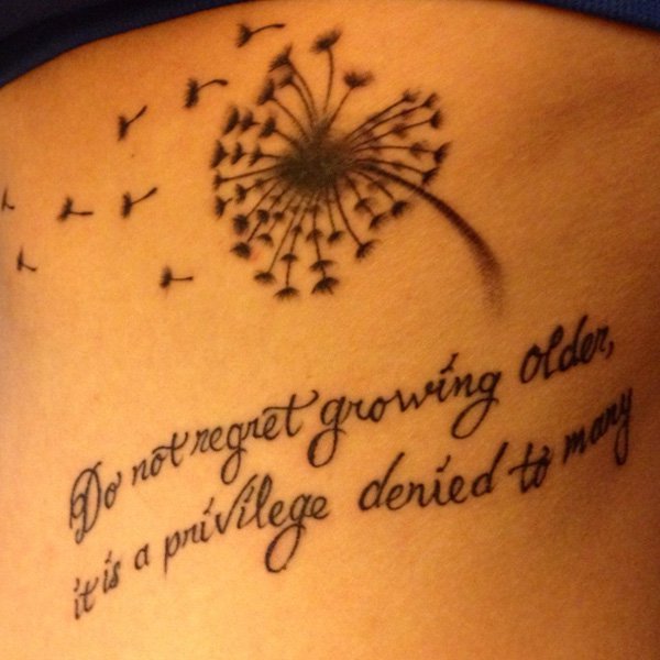 Dandelion Puff And Quote Tattoo On Side Rib