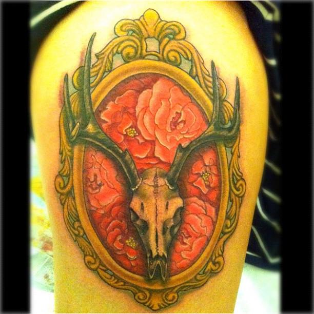 Deer Skull With Flowers In Frame Tattoo On Side Thigh