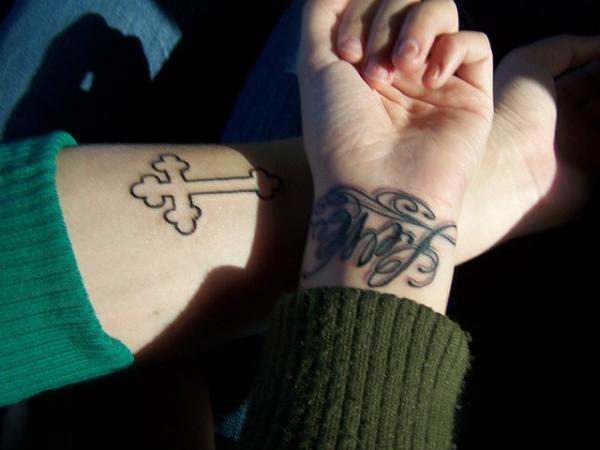 Empire Cross Wrist Tattoo