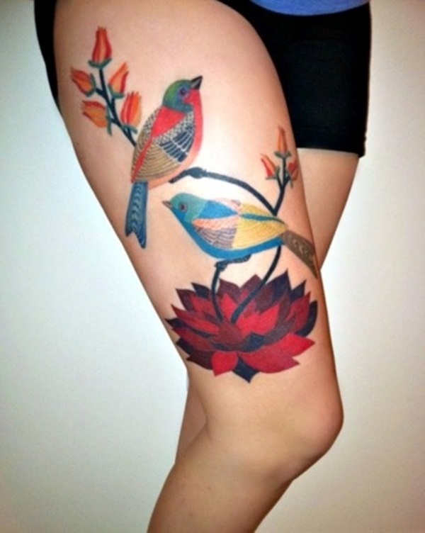 Fantastic Two Flying Birds With Lotus Flower Tattoo On Thigh
