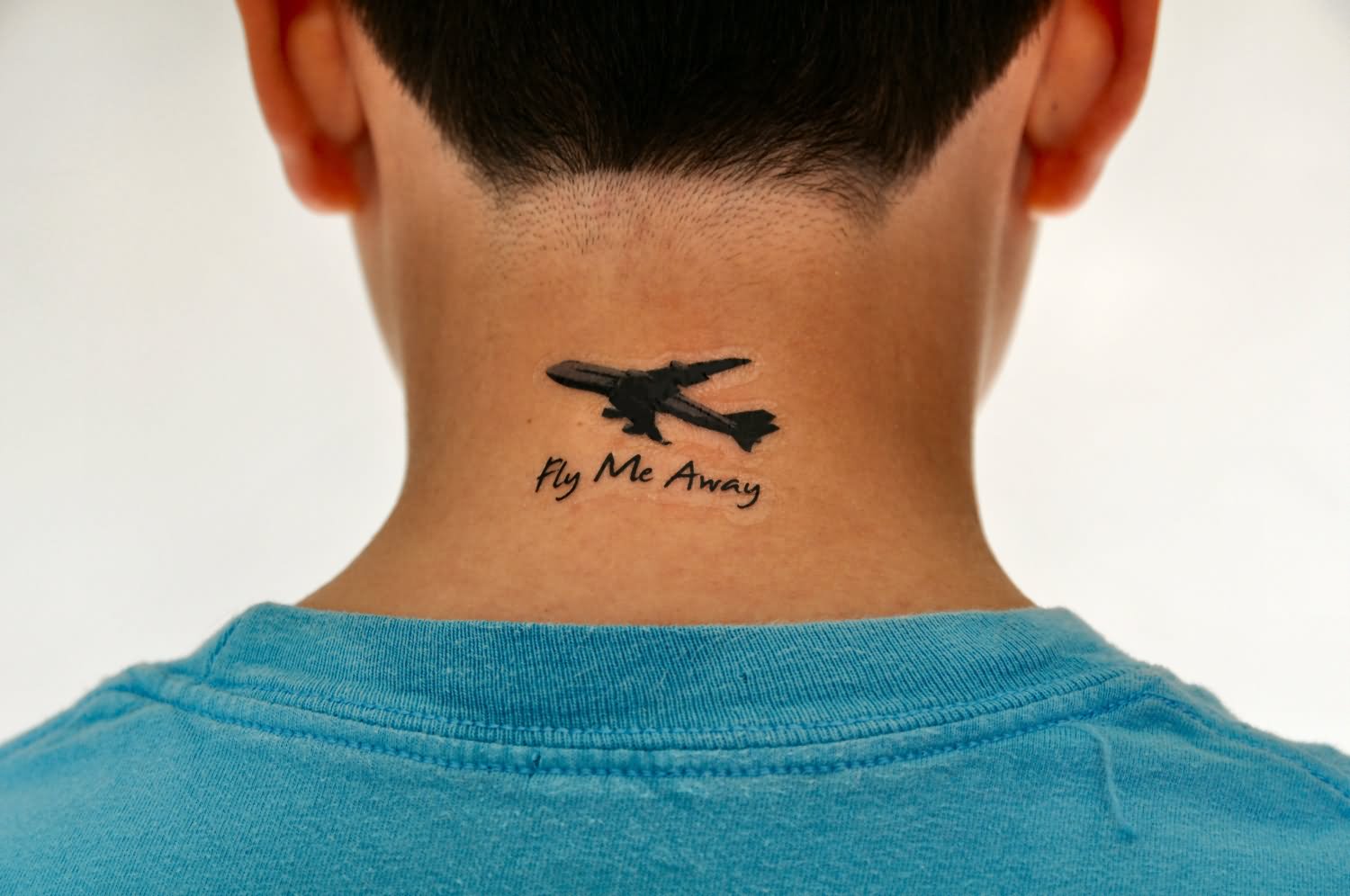Fly Me Away - Black Ink Airplane Tattoo On Man Back Neck