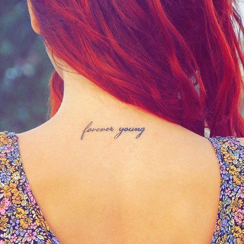 Forever Young Quote Tattoo On Girl Upper Back
