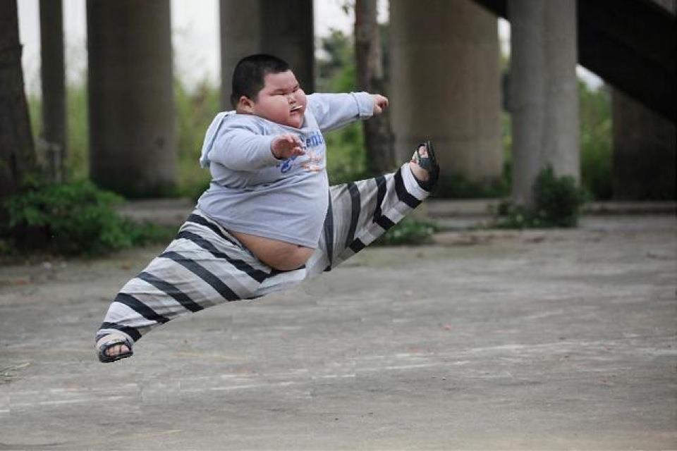 Funny Fat Ninja Kid Jumping Image