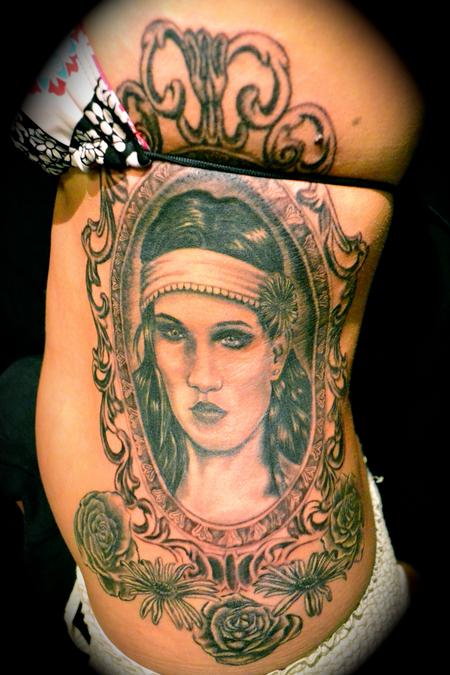 Girl Face In Frame Tattoo On Side Rib