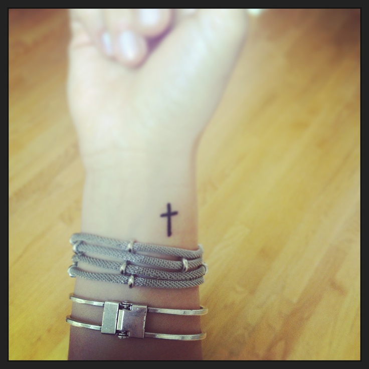 Girl Showing Her Black Cross Wrist Tattoo