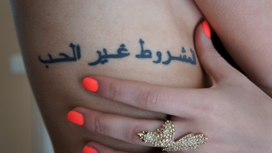 Girl With Arabic Tattoo On Side Rib