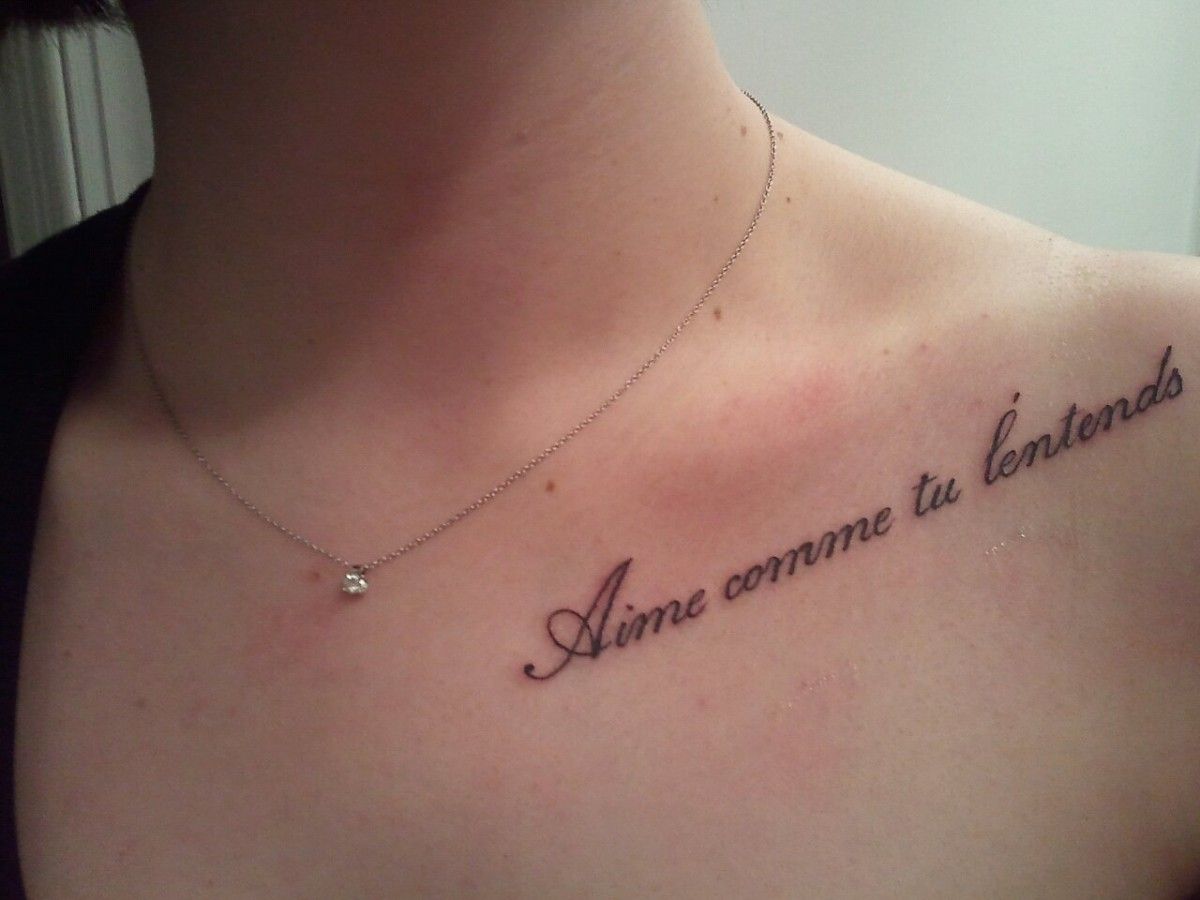 Girl With Quote Tattoo On Collarbone