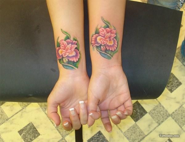 Girls Showing Wrist Flower Tattoos