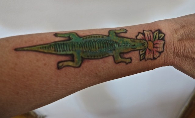 Green Ink Alligator With Flower Tattoo On Forearm