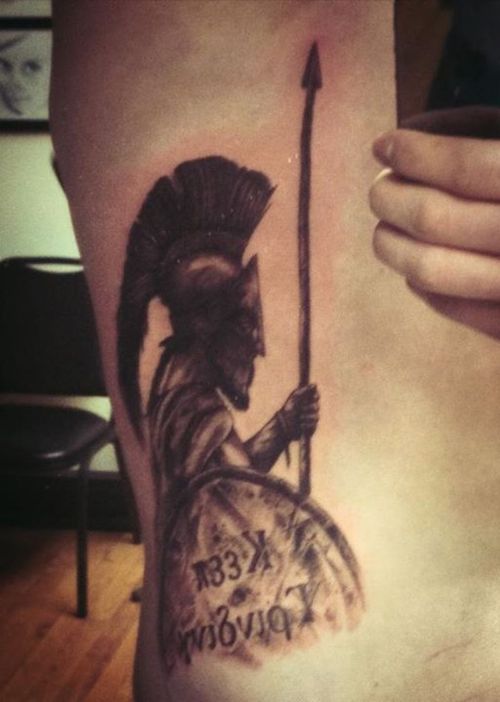Grey Ink Spartan Tattoo On Side Rib