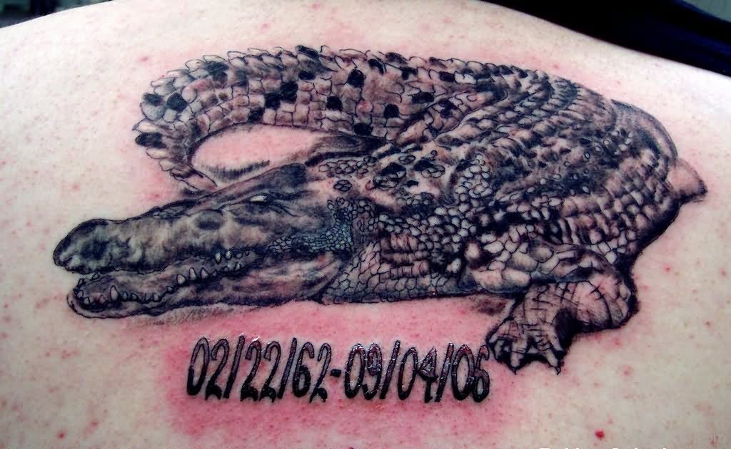 Memorial Black Ink Alligator Tattoo On Upper Back