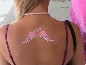 Pink Ink Angle Wings Tattoo On Girl Upper Back
