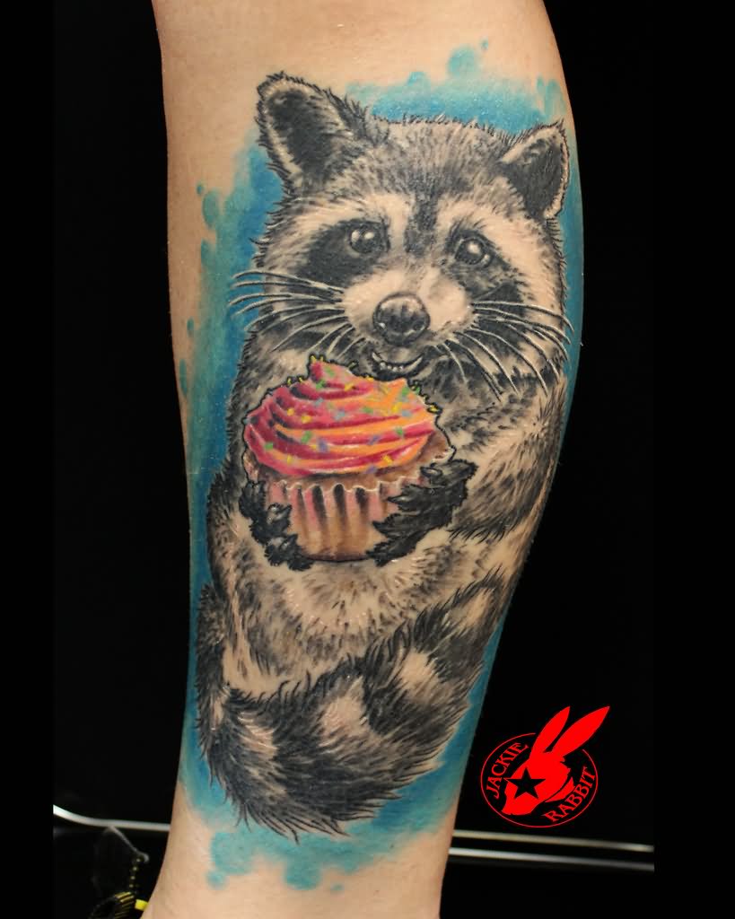 Raccoon With Cupcake Tattoo On Leg