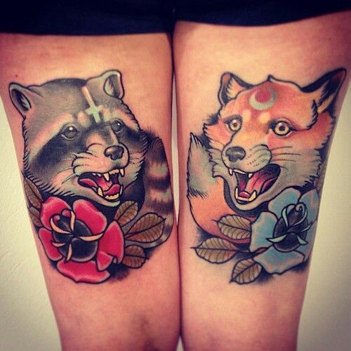 Red And Blue Flowers Raccoon Tattoos On Thigh