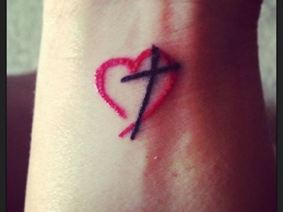 Red Heart And Black Cross Wrist Tattoo