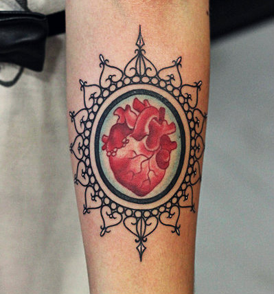 Red Real Heart In Frame Tattoo Design For Forearm