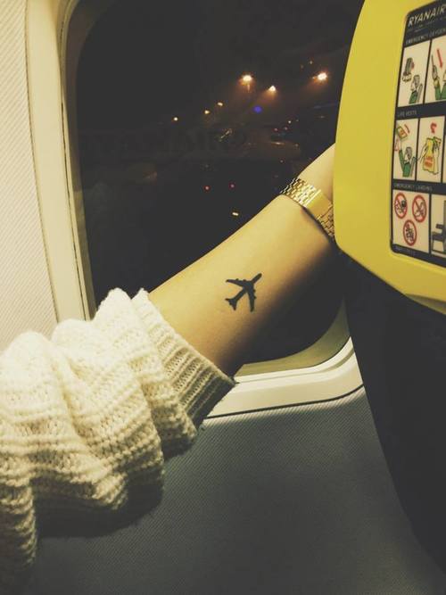 Silhouette Airplane Tattoo On Forearm