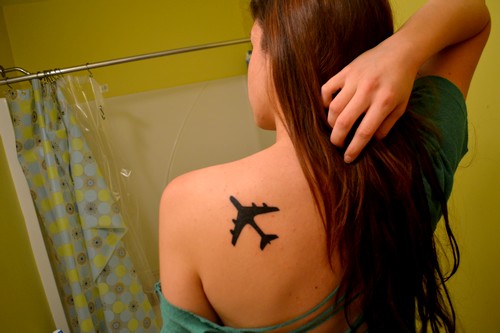 Silhouette Airplane Tattoo On Girl Left Back Shoulder