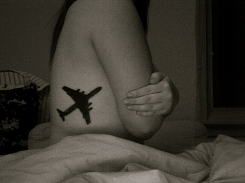 Silhouette Airplane Tattoo On Side Rib