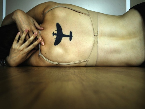 Silhouette Airplane Tattoo On Upper Back