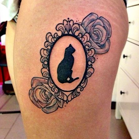 Silhouette Cat In Frame With Two Rose Tattoo On Side Thigh