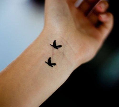 Silhouette Two Flying Bird Tattoo On Wrist