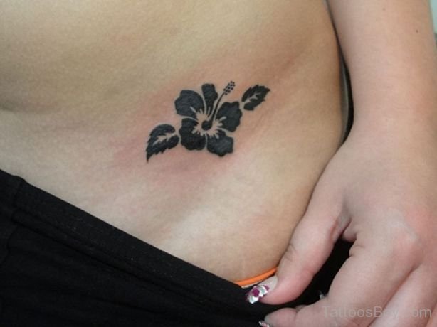 Small Black Flower Tattoo On Waist