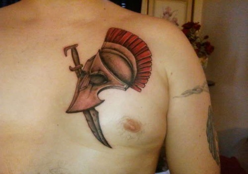 Spartan Helmet Tattoo On Man Chest