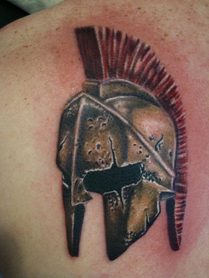 Spartan Helmet Tattoo On Man Left Back Shoulder