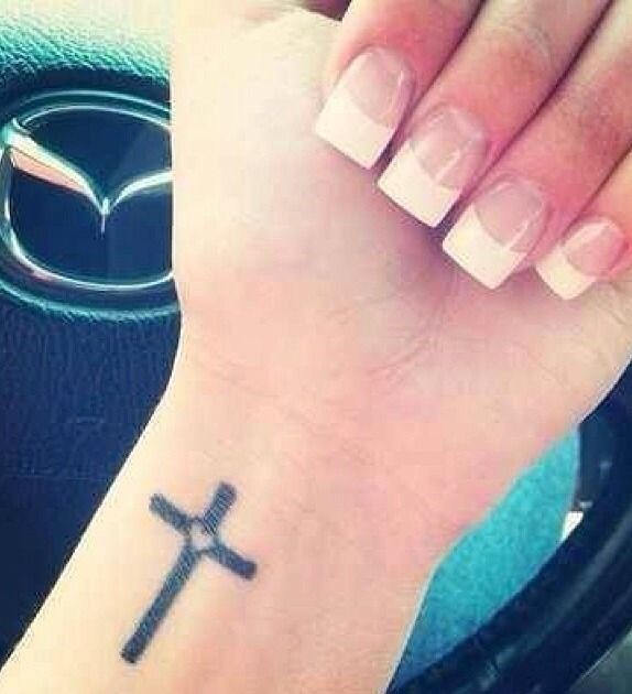 Tiny Heart In Black Cross Tattoo On Wrist