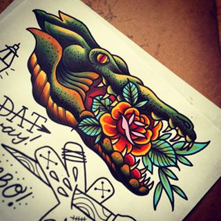 Traditional Rose In Alligator Mouth Tattoo Design