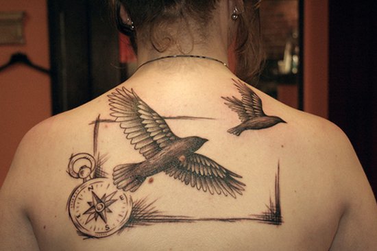 Two Flying Birds With Compass Tattoo On Upper Back