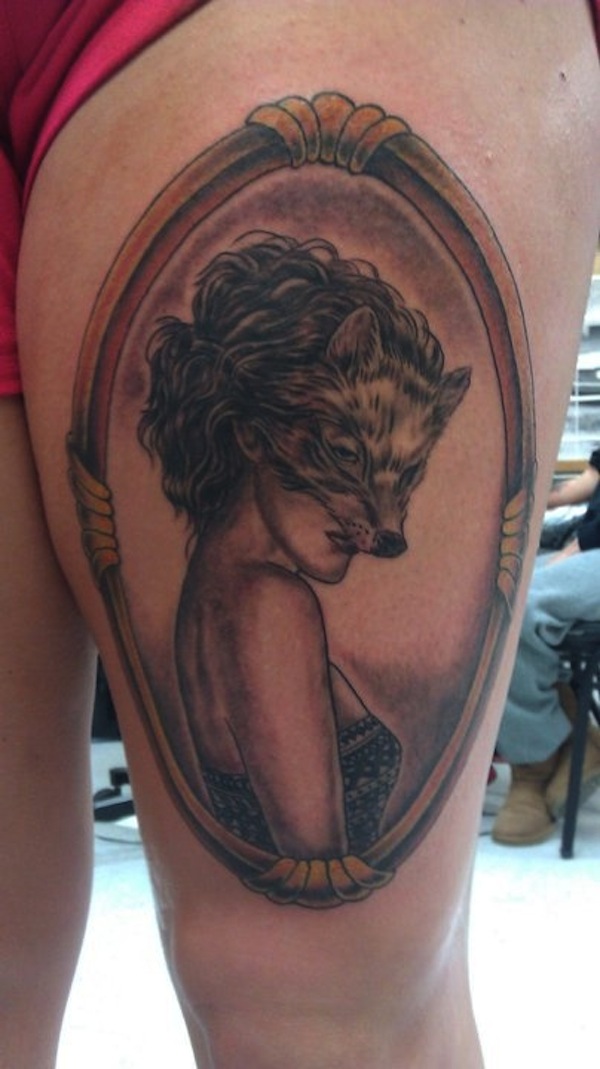 Wolf Head Girl Face In Frame Tattoo On Thigh