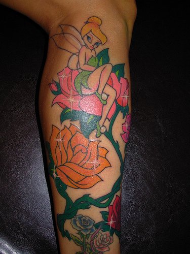 Animated Fairy With Roses Tattoo On Leg