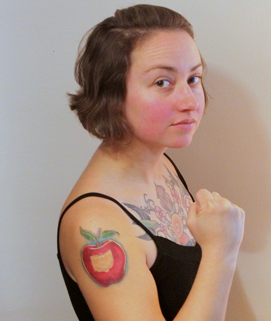 Apple Bite Tattoo On Girl Right Shoulder