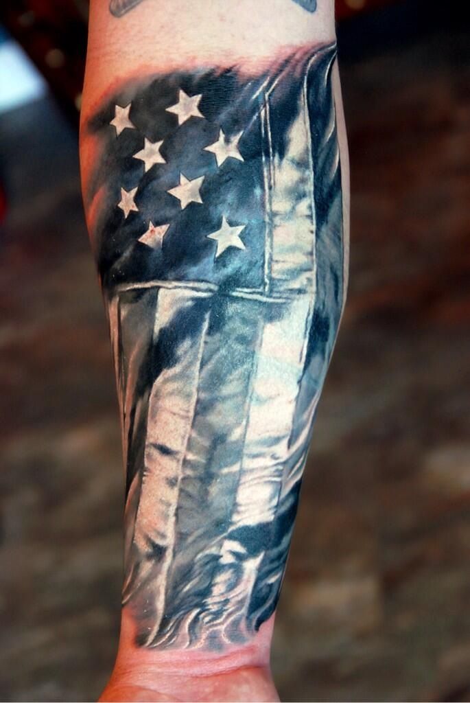 Black And Grey American Flag Tattoo On Forearm