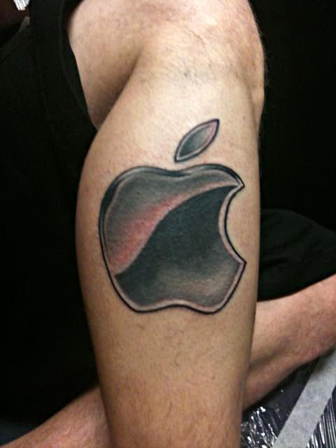 Black And Grey Apple Logo Tattoo On Leg