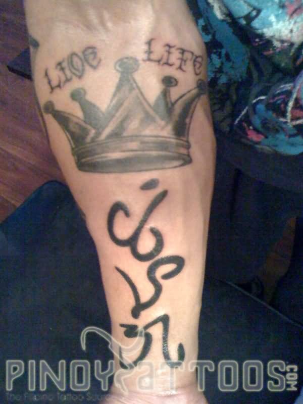 Black And Grey Crown And Alibata Tattoo On Forearm
