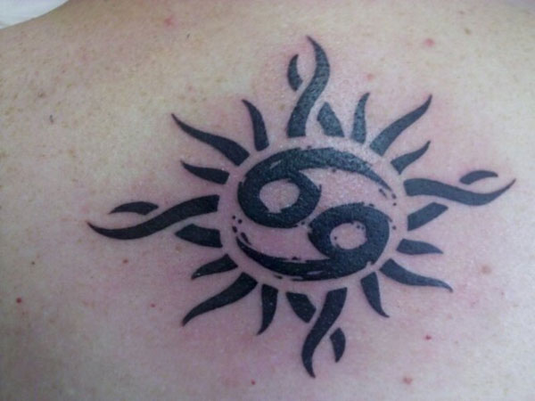 Black Tribal Sun With Cancer Tattoo On Back Shoulder