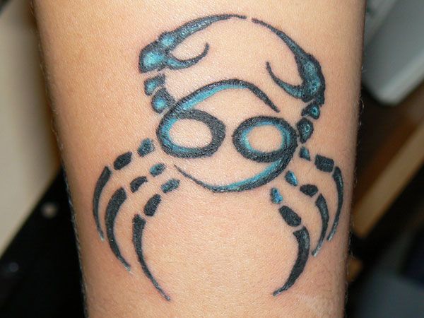 Blue And Black Cancer Zodiac Tattoo On Leg