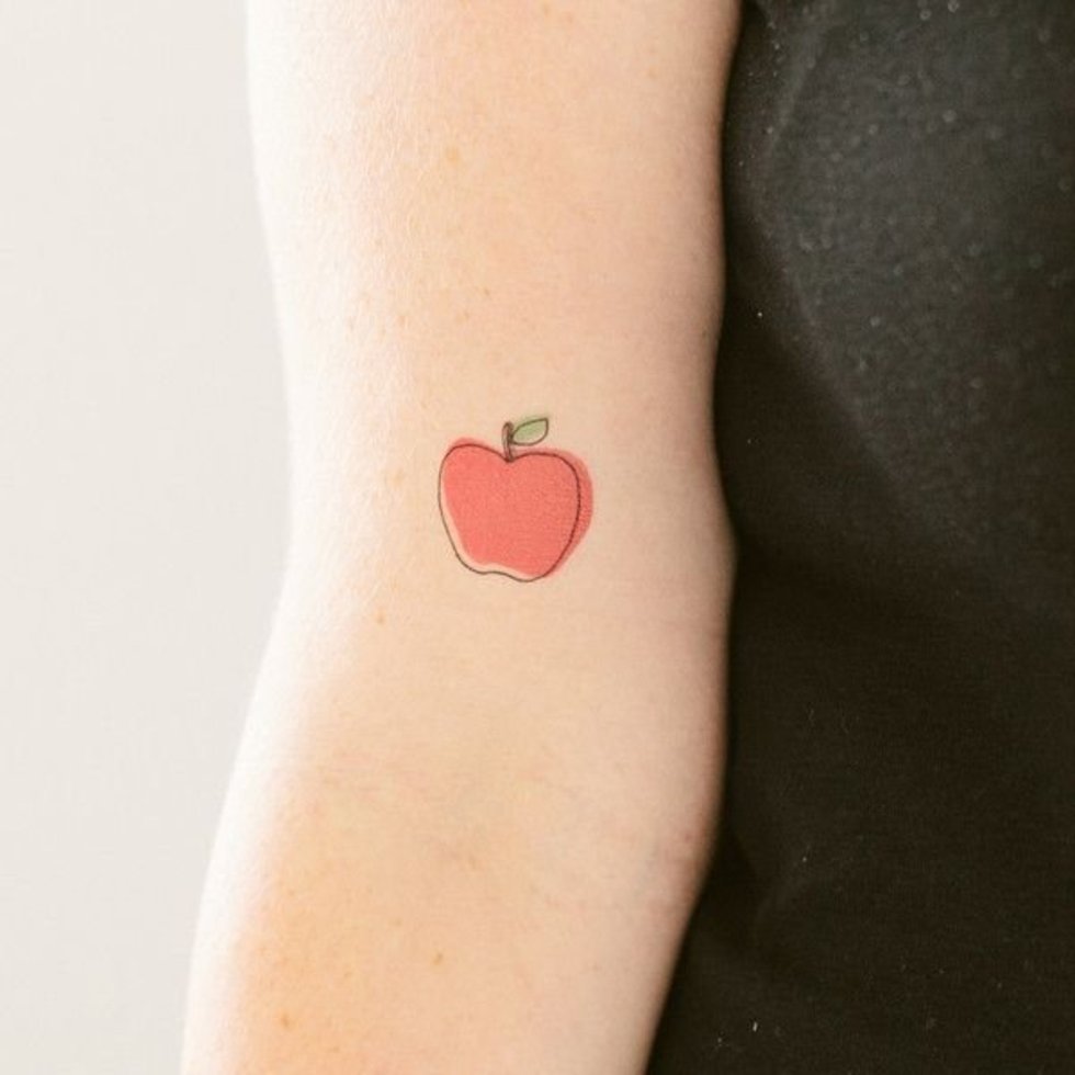 Cool Little Apple Tattoo On Bicep