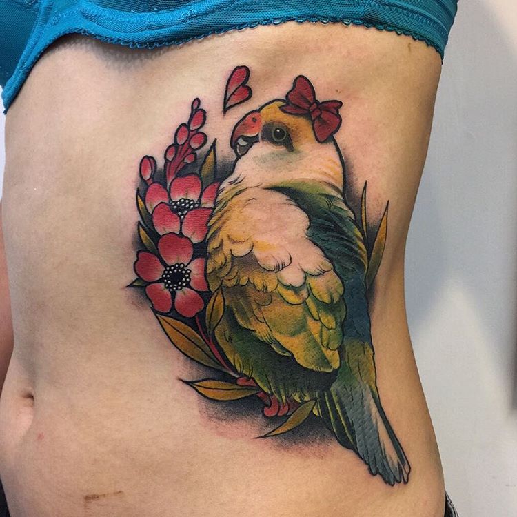 Cute Parrot With Flowers Tattoo On Girl Side Rib
