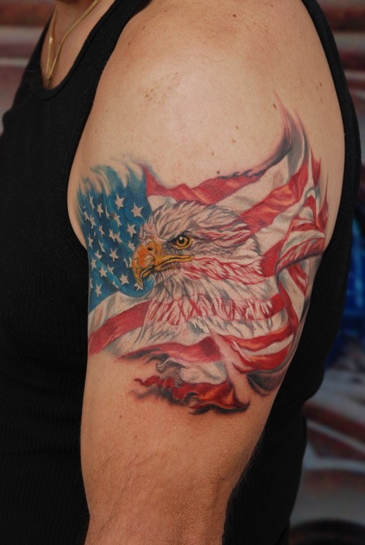 Eagle Head In American Flag Tattoo On Left Half Sleeve