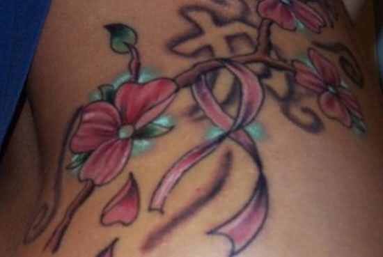 Flower And Ribbon Tattoo On Side Rib