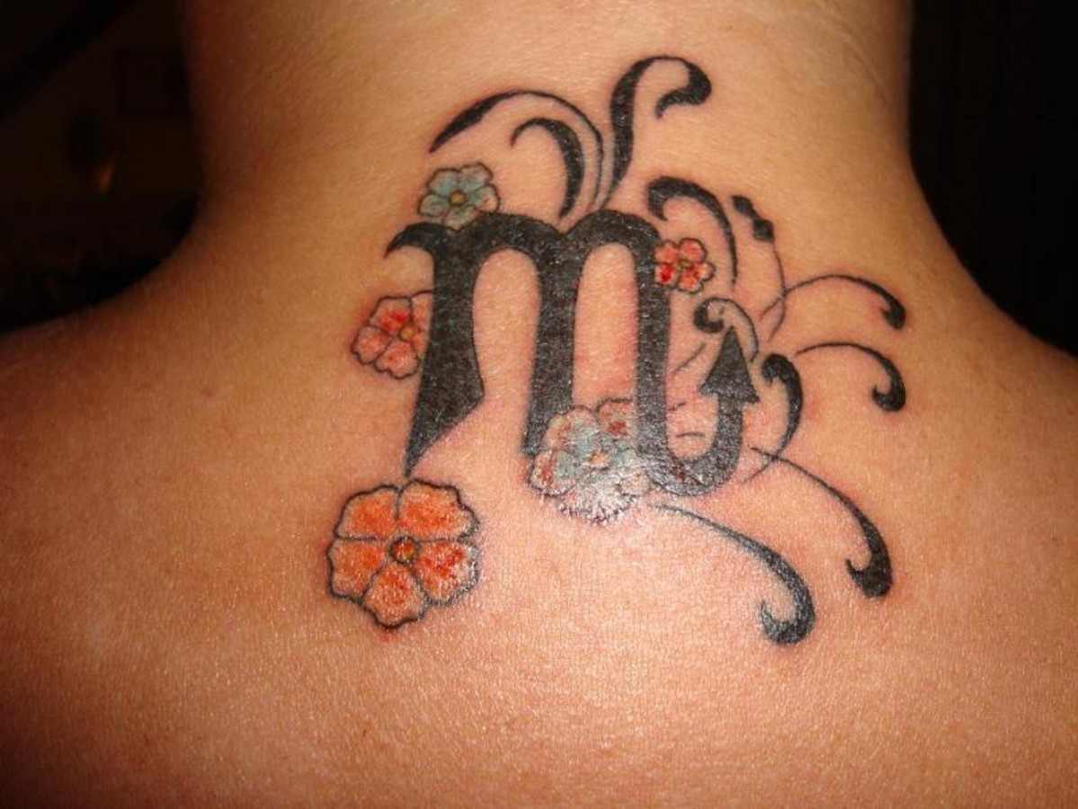 Flowers And Cancer Zodiac Tattoo On Upper Back