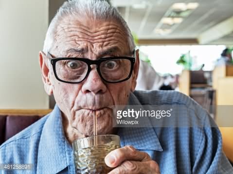 Funny Old Man Drinking With Straw