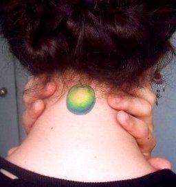 Green Apple Tattoo On Girl Back Neck