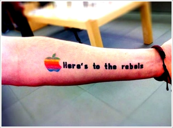 Here's To The Rebels - Colorful Apple Logo Tattoo On Forearm