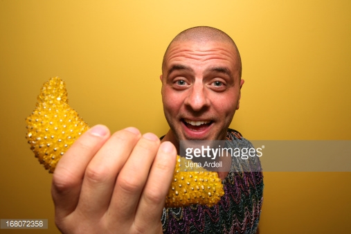 Man Making Funny Face Holding Fake Banana
