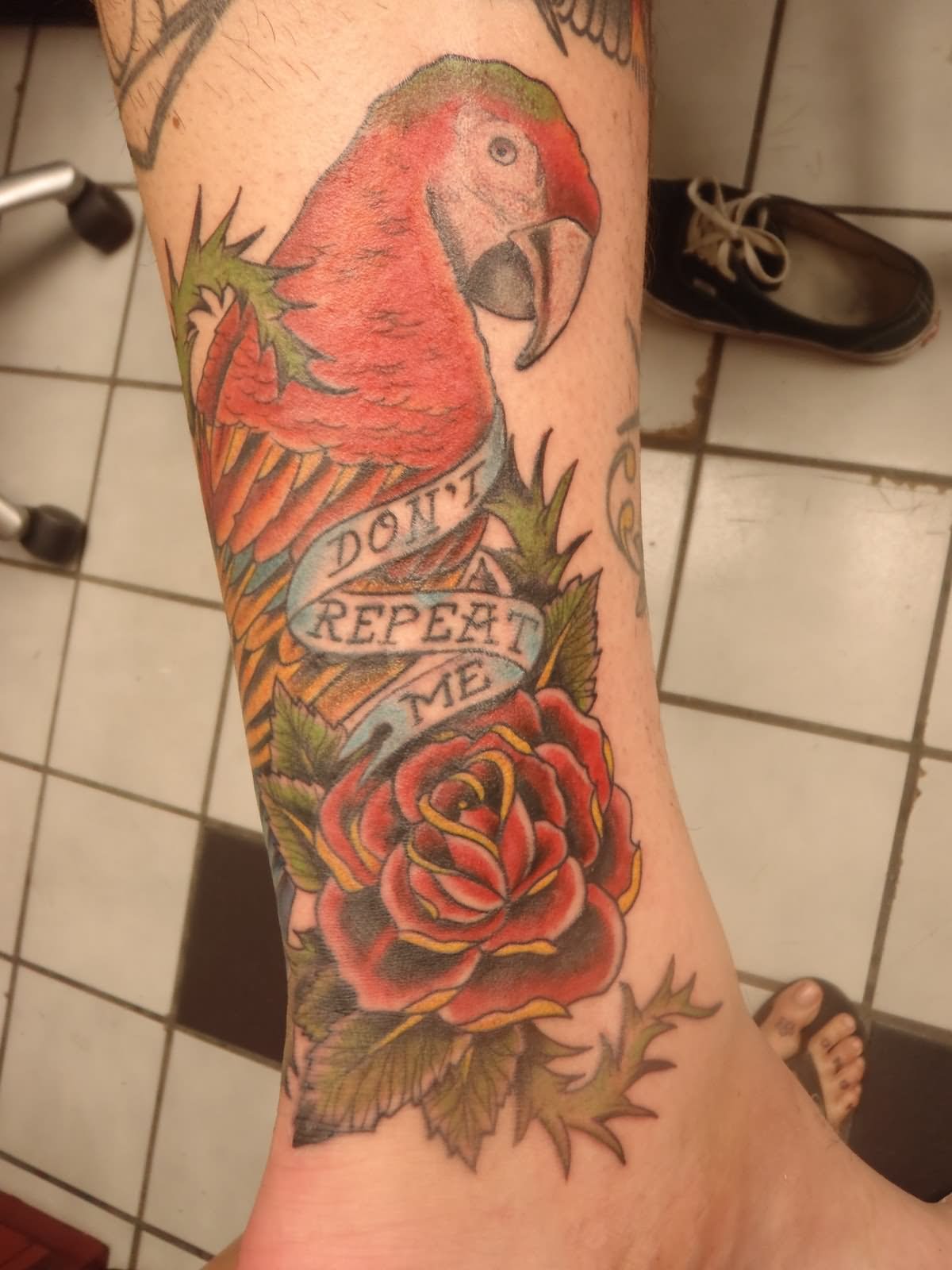 Parrot With Rose And Banner Tattoo Design For Leg